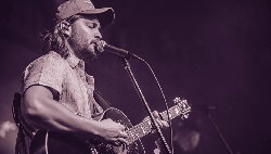 black and white image of singer Luke Grimes