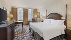 King room with large windows.
