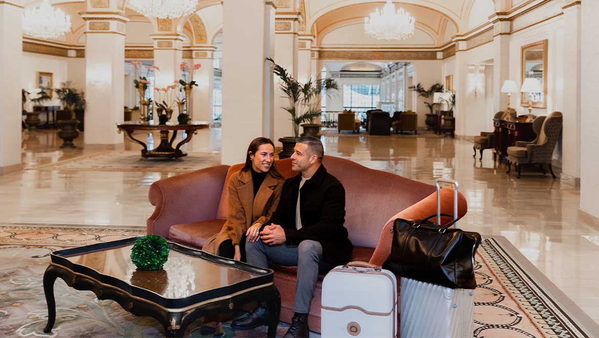 couple sitting in hotel lobby