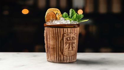 Mixed cocktail in a tiki-inspired cup
