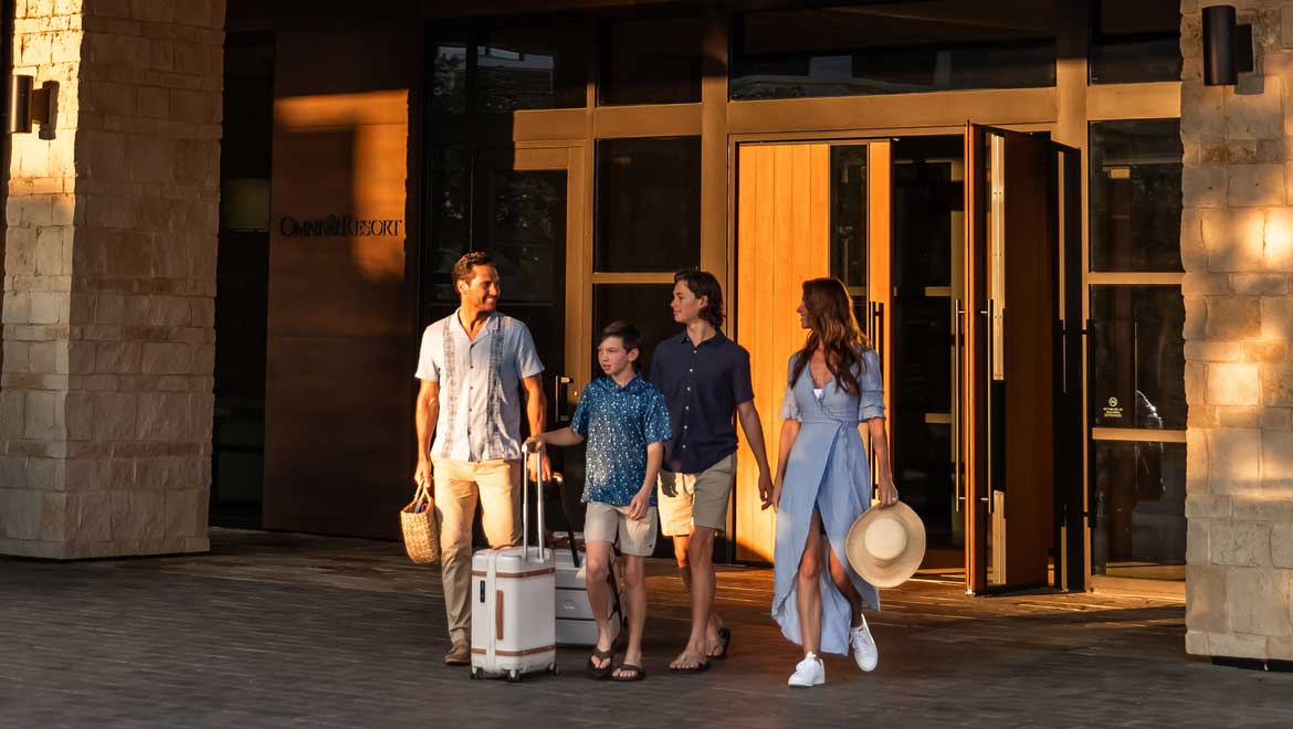 Family leaving hotel 